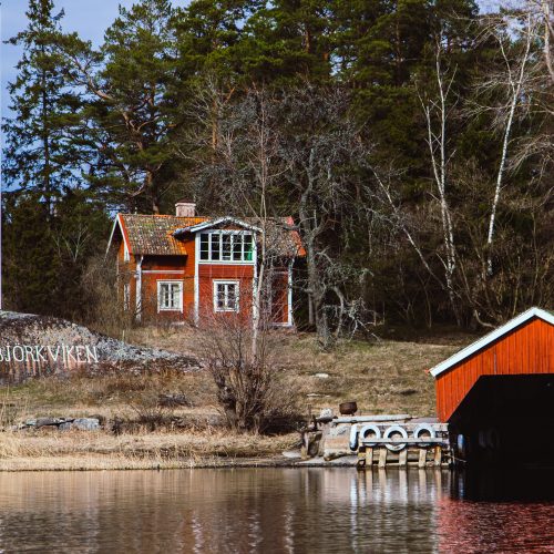 Typical red Swedish cottages on an island.