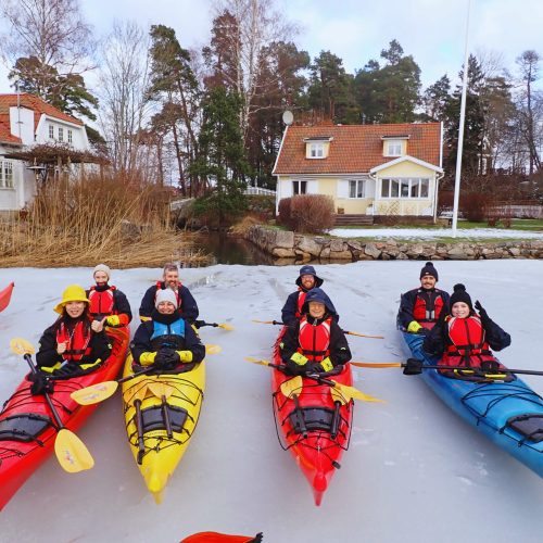 Kayakers taking a break on the ice