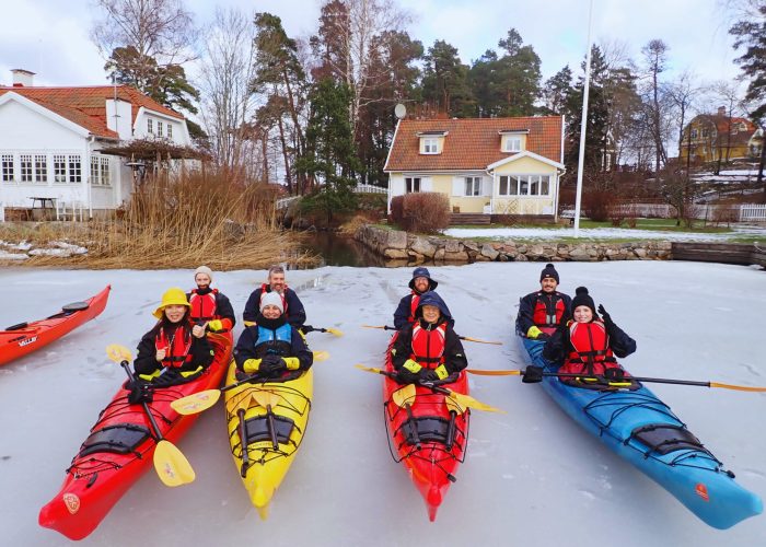 Kayakers taking a break on the ice