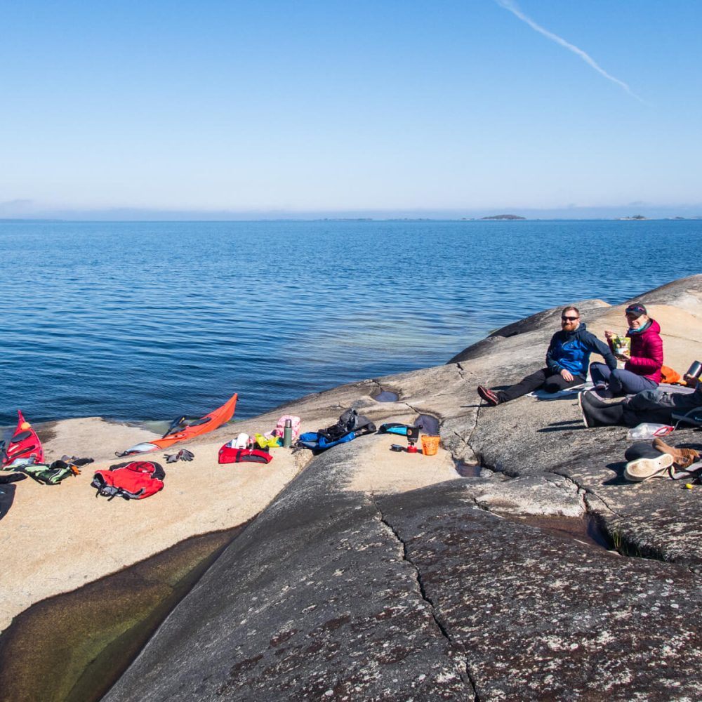 Kayakers' Coffee Break: Enjoying the Stunning Blue Sea and Sky