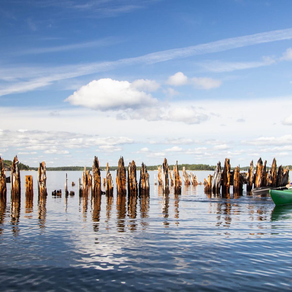 Shipwreck Remnants and Wooden Piers: Kayaking Between Husarö's Maritime Treasures
