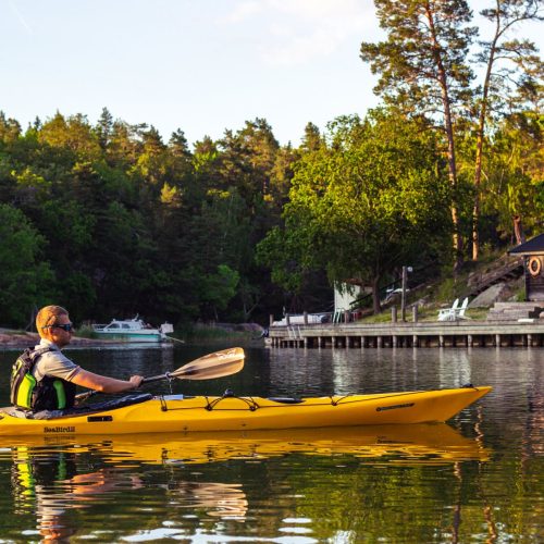 Exploring hidden gems while kayaking, discovering secret spots only accessible by water