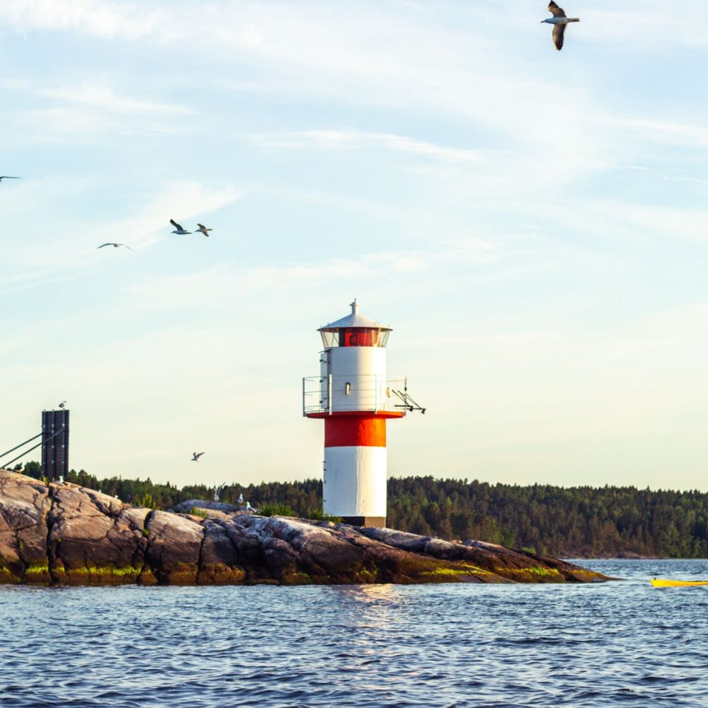 Passing by the picturesque lighthouse in our kayaks, its towering presence adding to the coastal charm