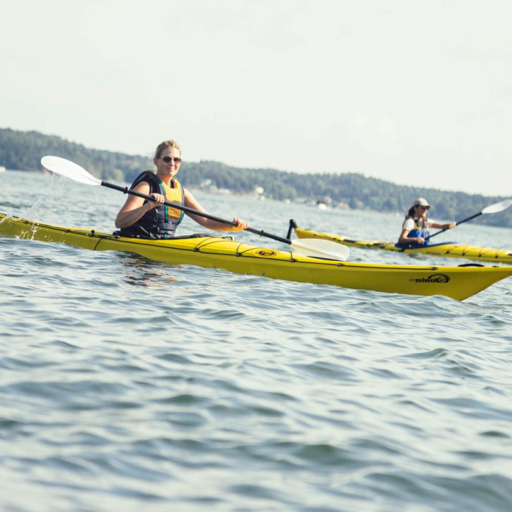 Experience the joy of a girls' kayaking trip in Vaxholm, where laughter and adventure abound amidst stunning scenery