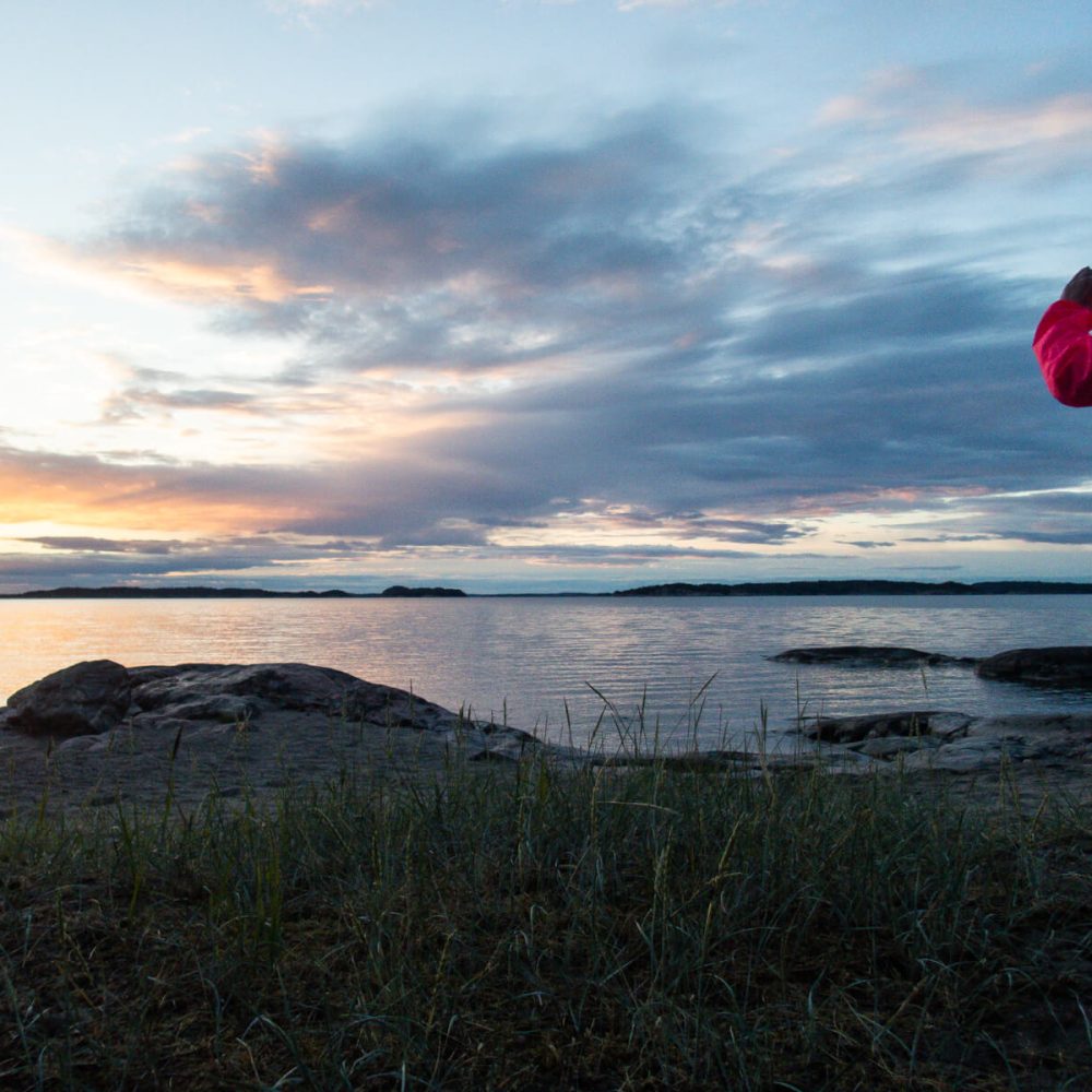 Capturing the sunset over the archipelago, a picturesque moment by the water's edge